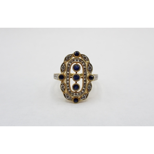 161 - A Sapphire and Diamond Cocktail Ring the openwork oval plaque millegrain-set three round sapphires w... 