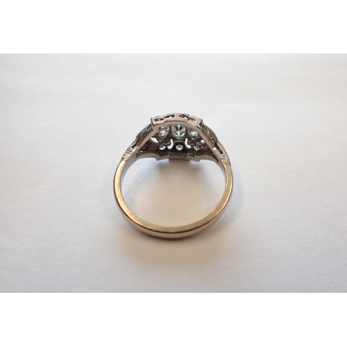 163 - A mid 20th Century Diamond three stone Ring the pierced mount rubover-set graduated marquise-cut sto... 