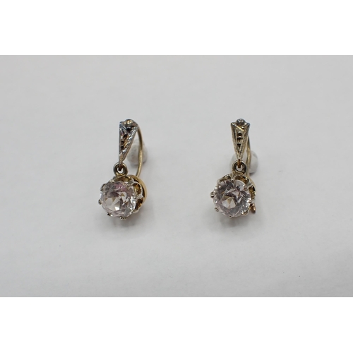 166 - A pair of drop Earrings each claw-set single white sapphire (possibly synthetic) on wire fittings