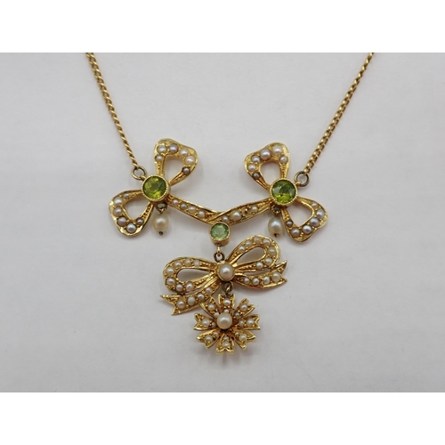 170 - An early 20th Century Peridot and Seed Pearl ribbon and bow Necklace millegrain-set three round peri... 