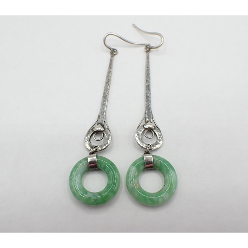 179 - A pair of Arts and Crafts Ear Pendants each with long hammered silver drop suspending faux jade ring