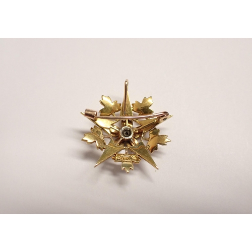 180 - A Diamond and Seed Pearl Star Pendant/Brooch claw-set old-cut diamond within seed pearls, marked 15c... 