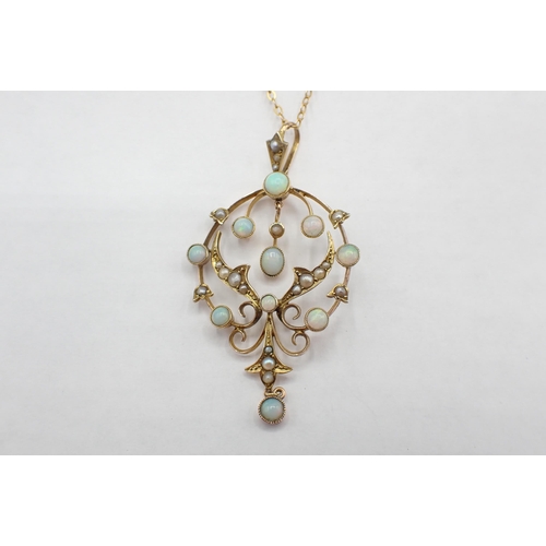 187 - An early 20th Century Opal and Seed Pearl Pendant the openwork plaque millegrain-set round opals and... 