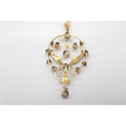 187 - An early 20th Century Opal and Seed Pearl Pendant the openwork plaque millegrain-set round opals and... 