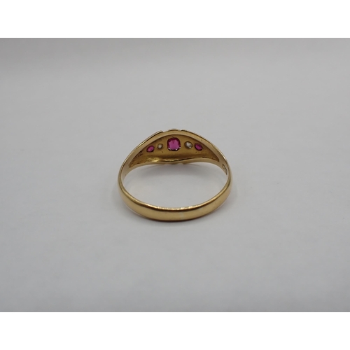 197 - An early 20th Century Ruby and Diamond five stone Ring pavé-set three cushion-cut rubies with old-cu... 