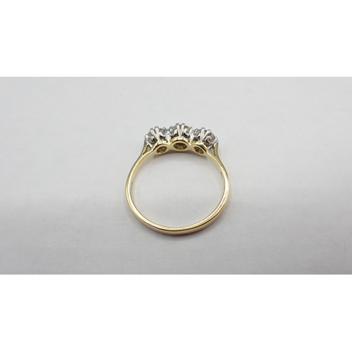 201 - A Diamond three stone Ring claw-set graduated brilliant-cut stones, estimated total diamond weight 1... 