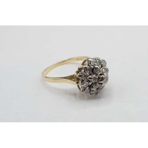 202 - A Diamond flower cluster Ring claw-set nineteen eight-cut stones in 18ct gold, ring size Q 1/2