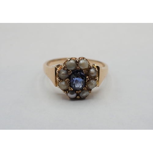 206 - A Sapphire and split Pearl Ring pavé-set oval-cut sapphire within frame of seed pearls, marked 9ct, ... 