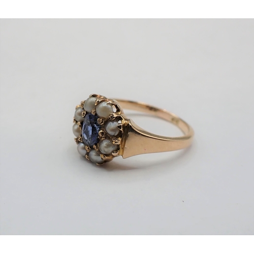 206 - A Sapphire and split Pearl Ring pavé-set oval-cut sapphire within frame of seed pearls, marked 9ct, ... 