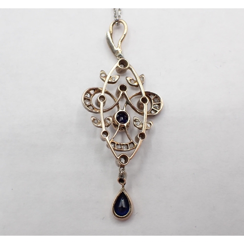 208 - An Edwardian Sapphire and Diamond Pendant the delicate openwork plaque rubover-set cushion-cut sapph... 