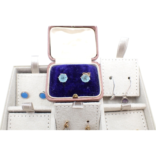 225 - A collection of mostly modern Ear Studs set various stones including amethyst, rubies and opals, thr... 