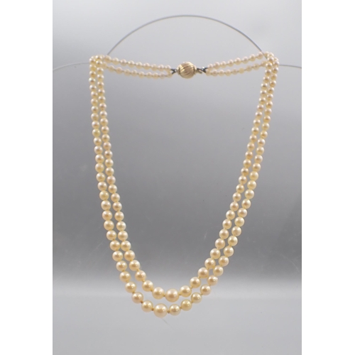 226 - A double row of good quality graduated Cultured Pearls on 18ct gold clasp