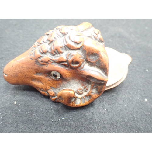 23 - A carved treen Snuff Mull in the form of a ram's head with inset glass eyes, 3in