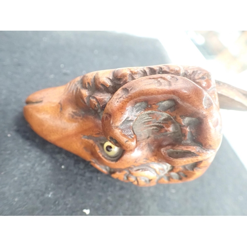 23 - A carved treen Snuff Mull in the form of a ram's head with inset glass eyes, 3in