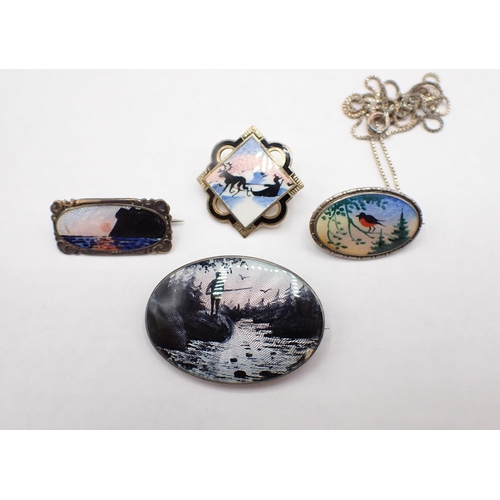 237 - Four Norwegian silver and enamel Silhouette Brooches depicting; fisherman 40mm wide, coastal sunset ... 