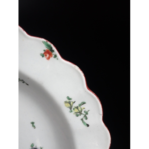 293 - An early Worcester shallow Dish painted floral sprays in bright enamels, iron red, shaped rim, 8¼in ... 