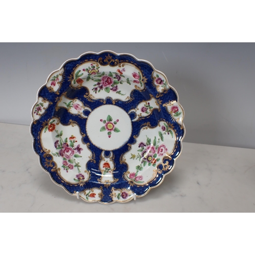 299 - Two Worcester scale blue Plates with shaped rims, floral painted ponds, richly gilt borders, and a C... 