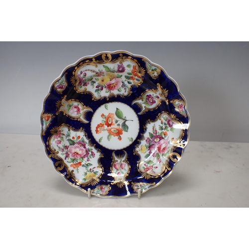 299 - Two Worcester scale blue Plates with shaped rims, floral painted ponds, richly gilt borders, and a C... 