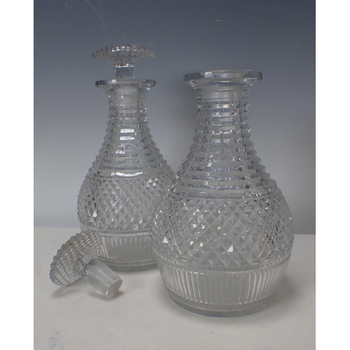 311 - A pair of Georgian cut glass Decanters and Stoppers with diamond cut designs, 9½in H