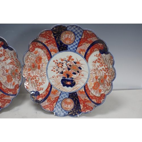 343 - A pair of Imari Dishes, lobed border, floral and geometric decorated panels, 12in D