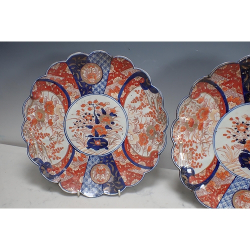 343 - A pair of Imari Dishes, lobed border, floral and geometric decorated panels, 12in D