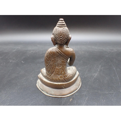 349 - A bronze seated Buddha with brown patination, 5½in