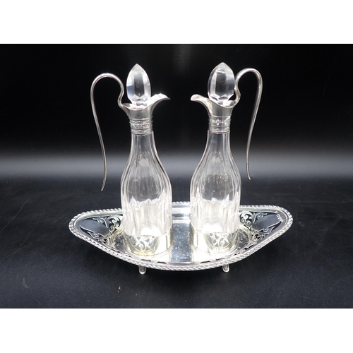 35 - A pair of Edward VII silver-mounted cut-glass Vinegar Bottles on pierced oval stand having gadroon r... 