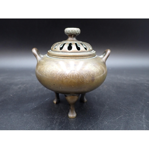 350 - A small bronze Pot Pourri and Cover with flower finial and silver wirework floral inlay, 4in