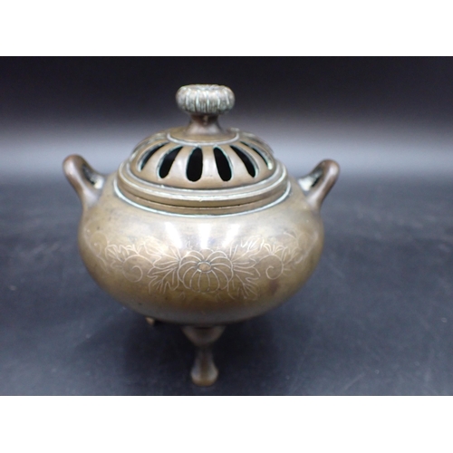 350 - A small bronze Pot Pourri and Cover with flower finial and silver wirework floral inlay, 4in