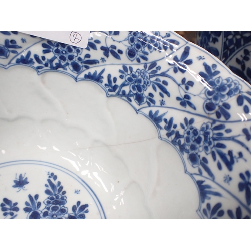 353 - A Chinese blue and white circular Bowl, painted arched panels of flowers, 9in, and another with moul... 