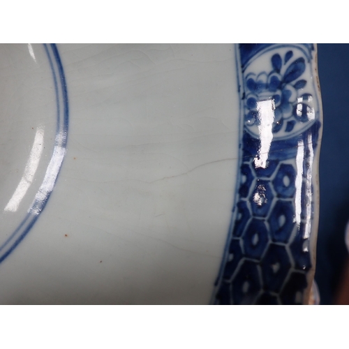 353 - A Chinese blue and white circular Bowl, painted arched panels of flowers, 9in, and another with moul... 