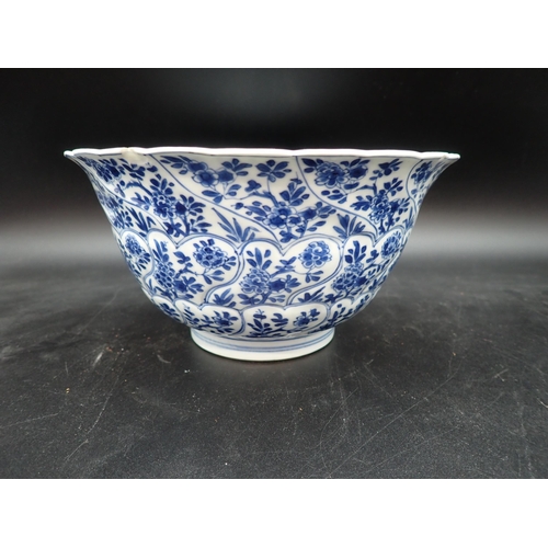 353 - A Chinese blue and white circular Bowl, painted arched panels of flowers, 9in, and another with moul... 