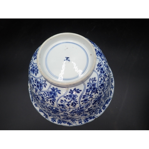 353 - A Chinese blue and white circular Bowl, painted arched panels of flowers, 9in, and another with moul... 