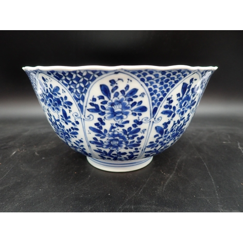 353 - A Chinese blue and white circular Bowl, painted arched panels of flowers, 9in, and another with moul... 