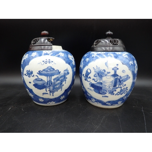 354 - A near pair of Chinese blue and white Ginger Jars with shaped oval reserves painted utensils, etc, p... 