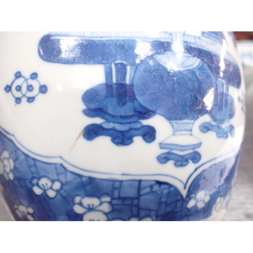 354 - A near pair of Chinese blue and white Ginger Jars with shaped oval reserves painted utensils, etc, p... 