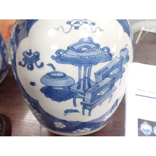 354 - A near pair of Chinese blue and white Ginger Jars with shaped oval reserves painted utensils, etc, p... 