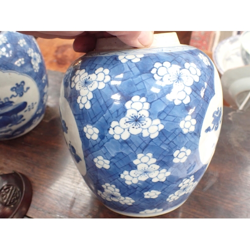 354 - A near pair of Chinese blue and white Ginger Jars with shaped oval reserves painted utensils, etc, p... 