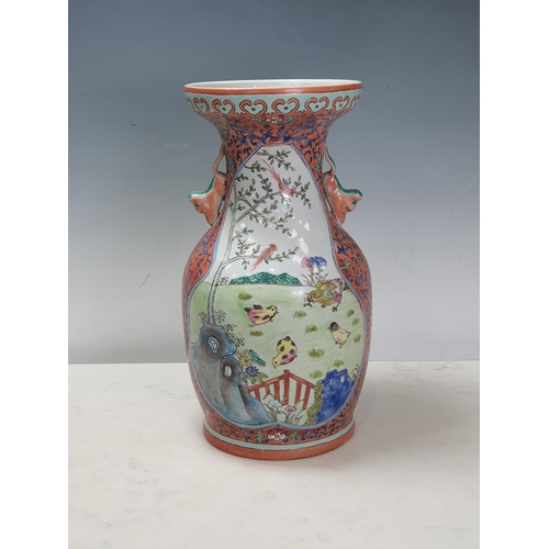 365 - A Chinese baluster Vase painted panels with chickens in a landscape, 13 1/2in H