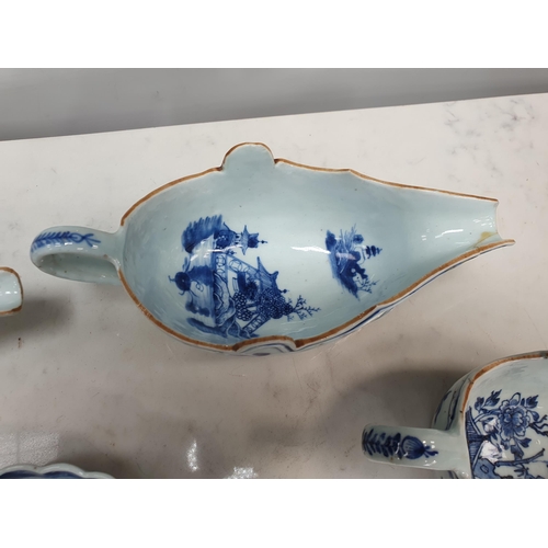 369 - Four Chinese blue & white Sauceboats, decorated flowers and landscapes, 9 1/2 and 7 1/2 in one A/F