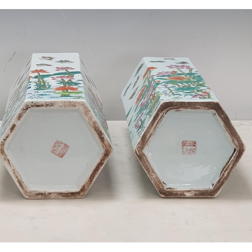 375 - A pair of hexagonal Chinese Vases decorated flowers and butterflies, 11in H