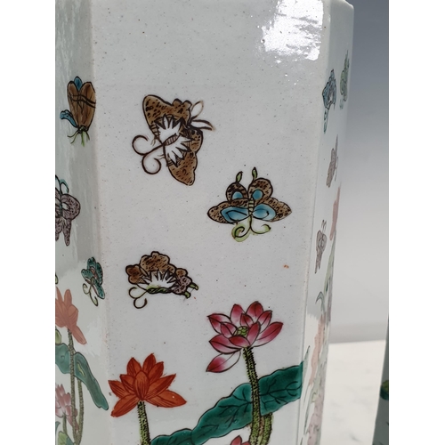 375 - A pair of hexagonal Chinese Vases decorated flowers and butterflies, 11in H