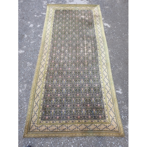 380 - A William Morris design Carpet having floral centre design. multi bordered with diamond shaped desig... 