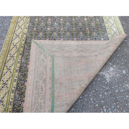 380 - A William Morris design Carpet having floral centre design. multi bordered with diamond shaped desig... 