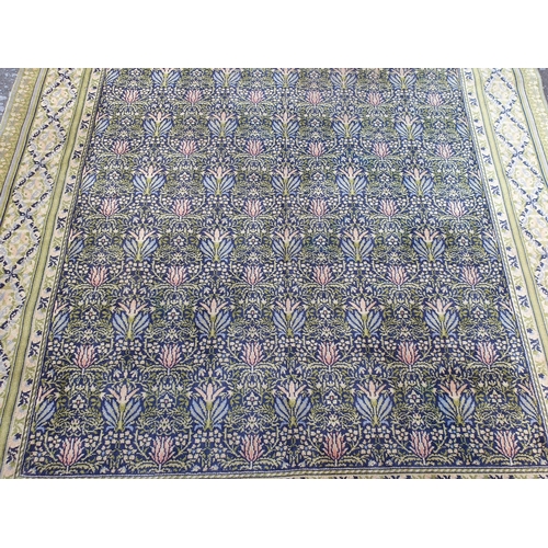 380 - A William Morris design Carpet having floral centre design. multi bordered with diamond shaped desig... 