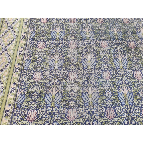 380 - A William Morris design Carpet having floral centre design. multi bordered with diamond shaped desig... 