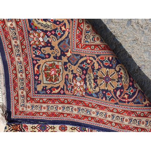 381 - A Persian woollen Rug with graduated lozenges infilled with stylised floral decoration on red, blue ... 