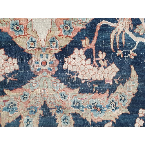 383 - A fine cotton Persian Rug with floral motifs to the multiple borders, the central design of exotic b... 