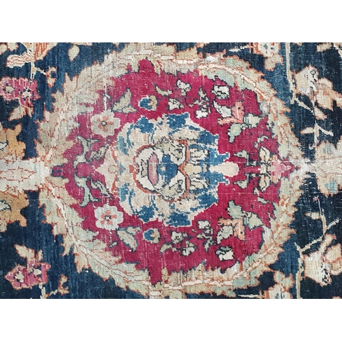 383 - A fine cotton Persian Rug with floral motifs to the multiple borders, the central design of exotic b... 