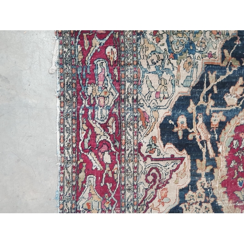 383 - A fine cotton Persian Rug with floral motifs to the multiple borders, the central design of exotic b... 